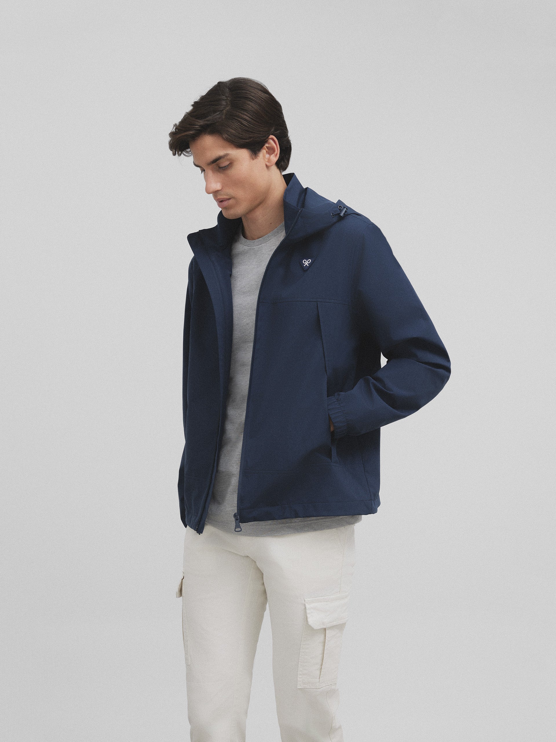 Blue hooded windbreaker jacket