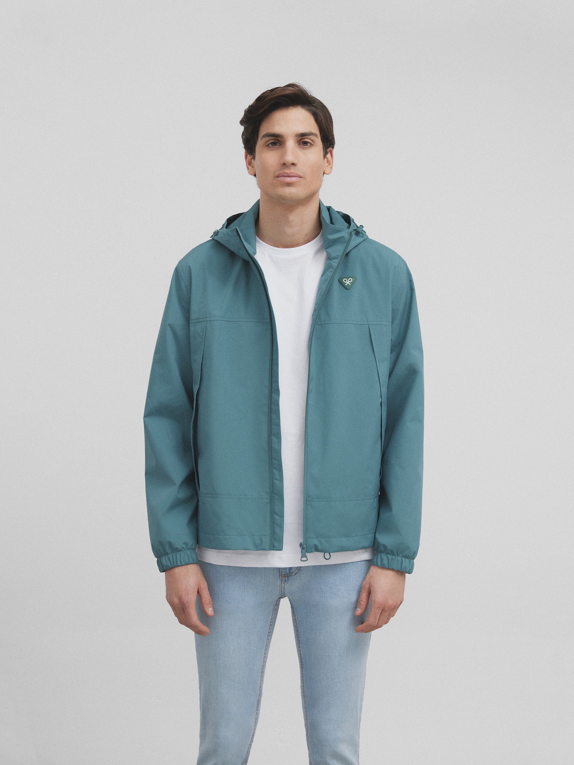 Green hooded windbreaker jacket