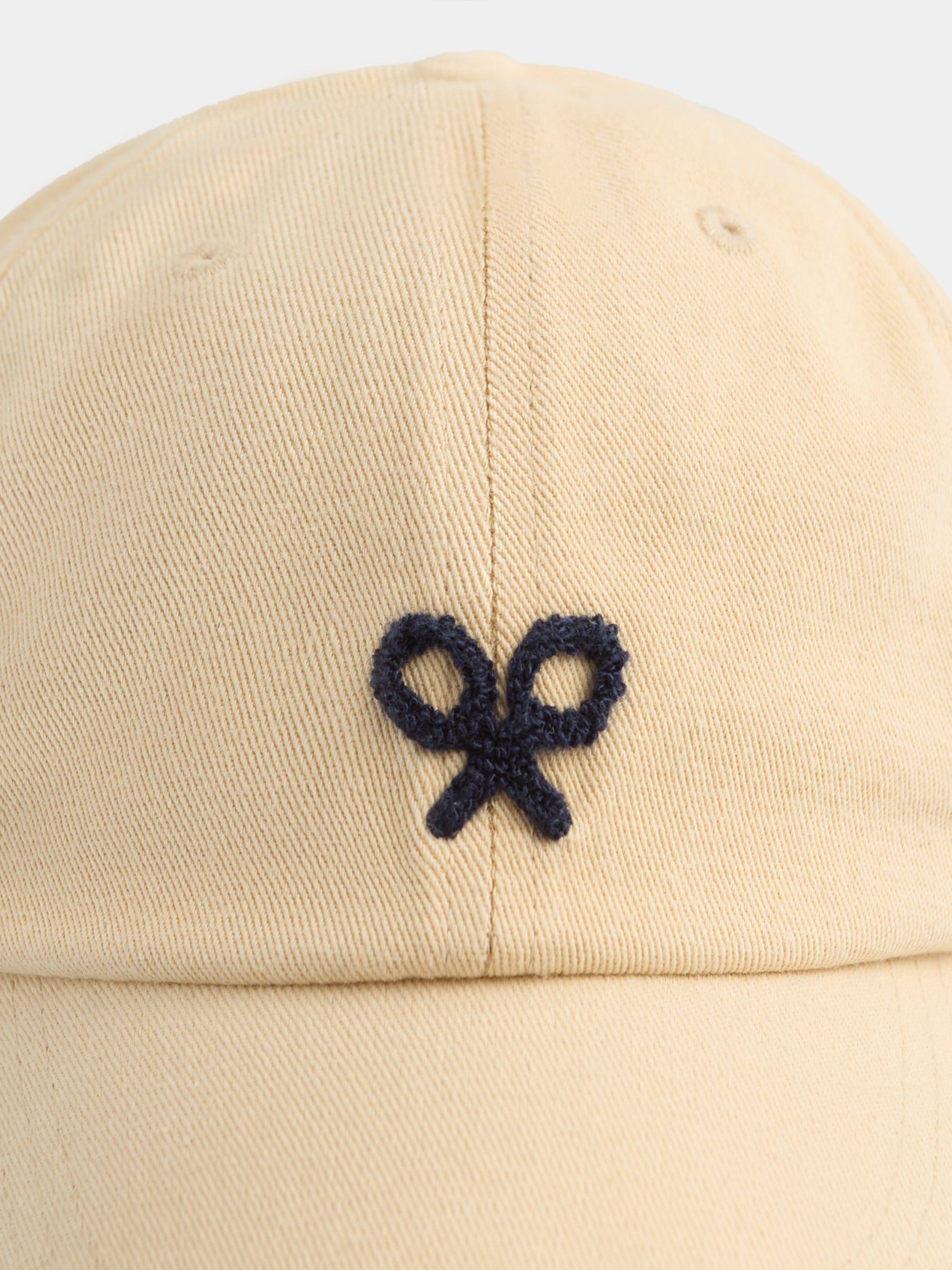 Beige embroidered racquet cap