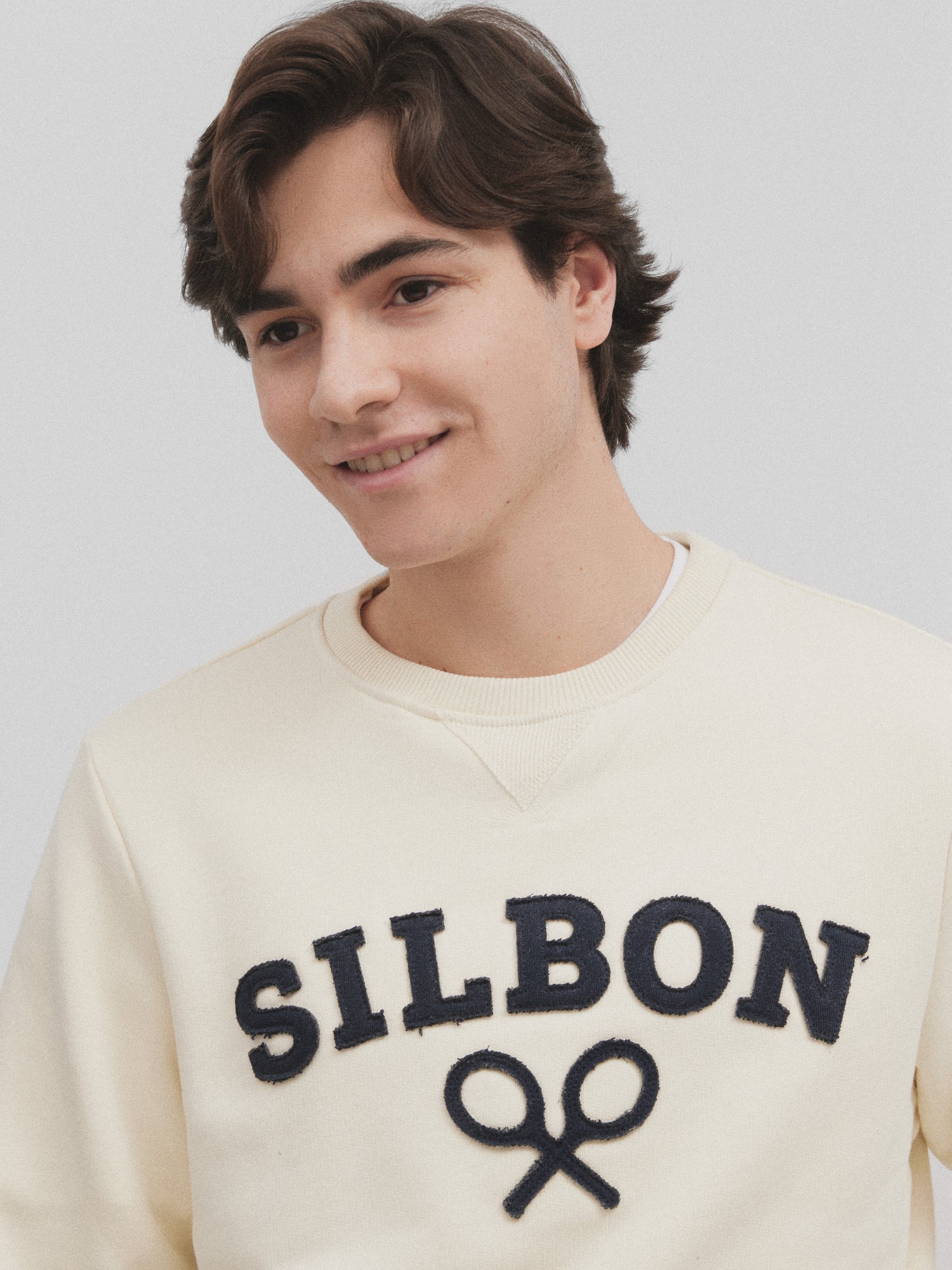 Half cream silbon racket sweatshirt