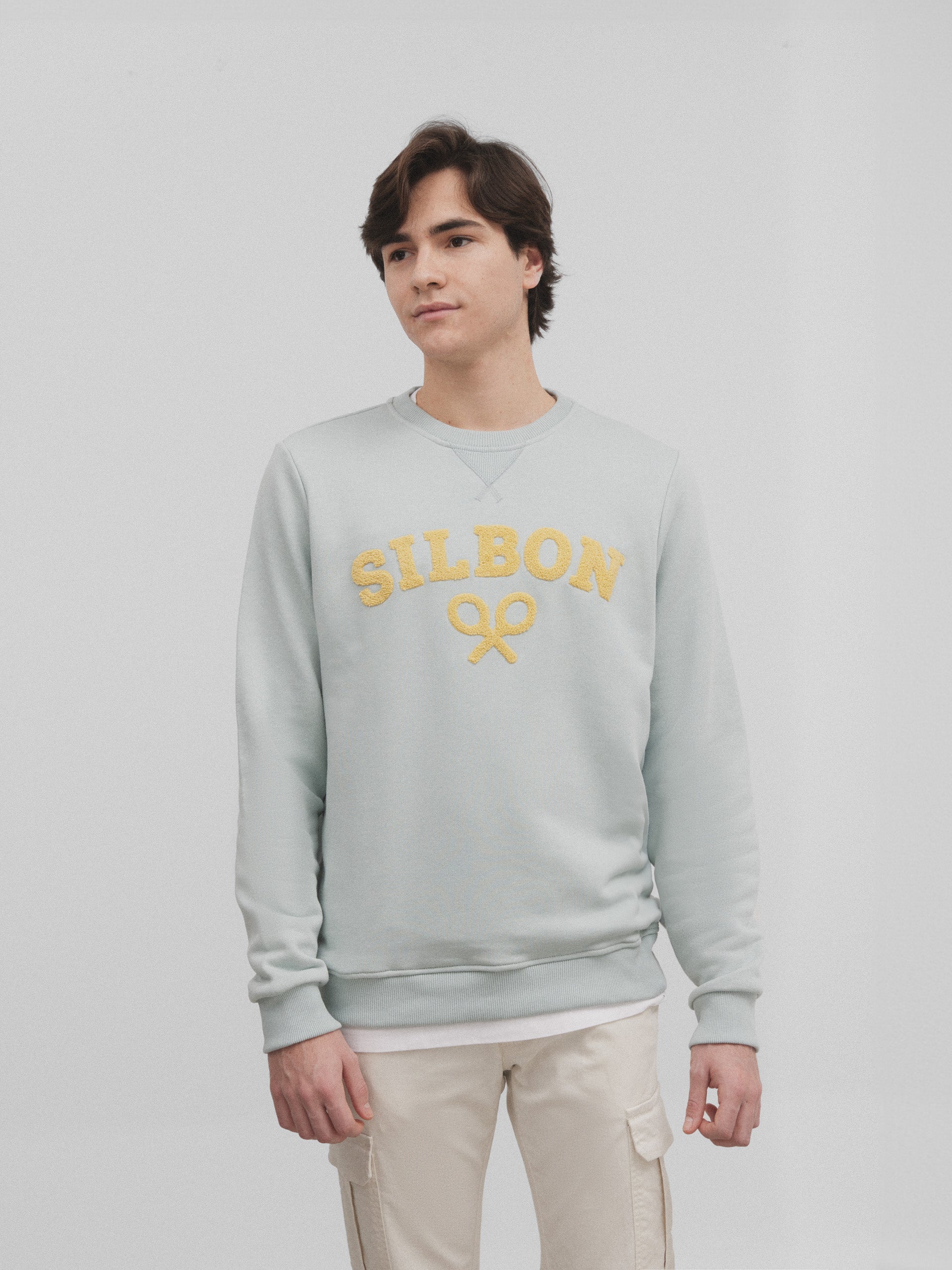 Half aquamarine silbon racket sweatshirt