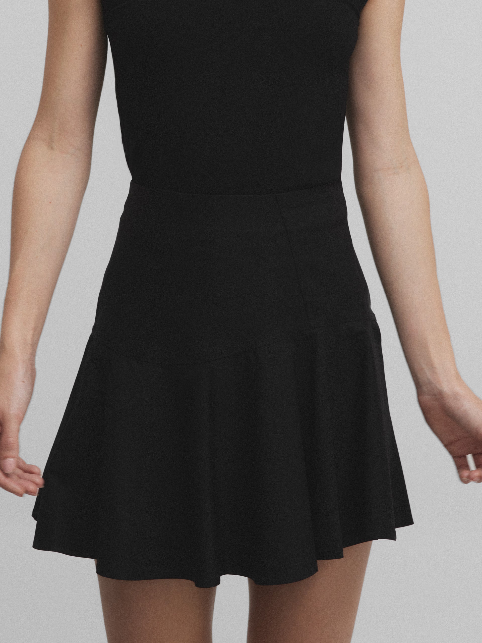 Black ruffled mini skirt