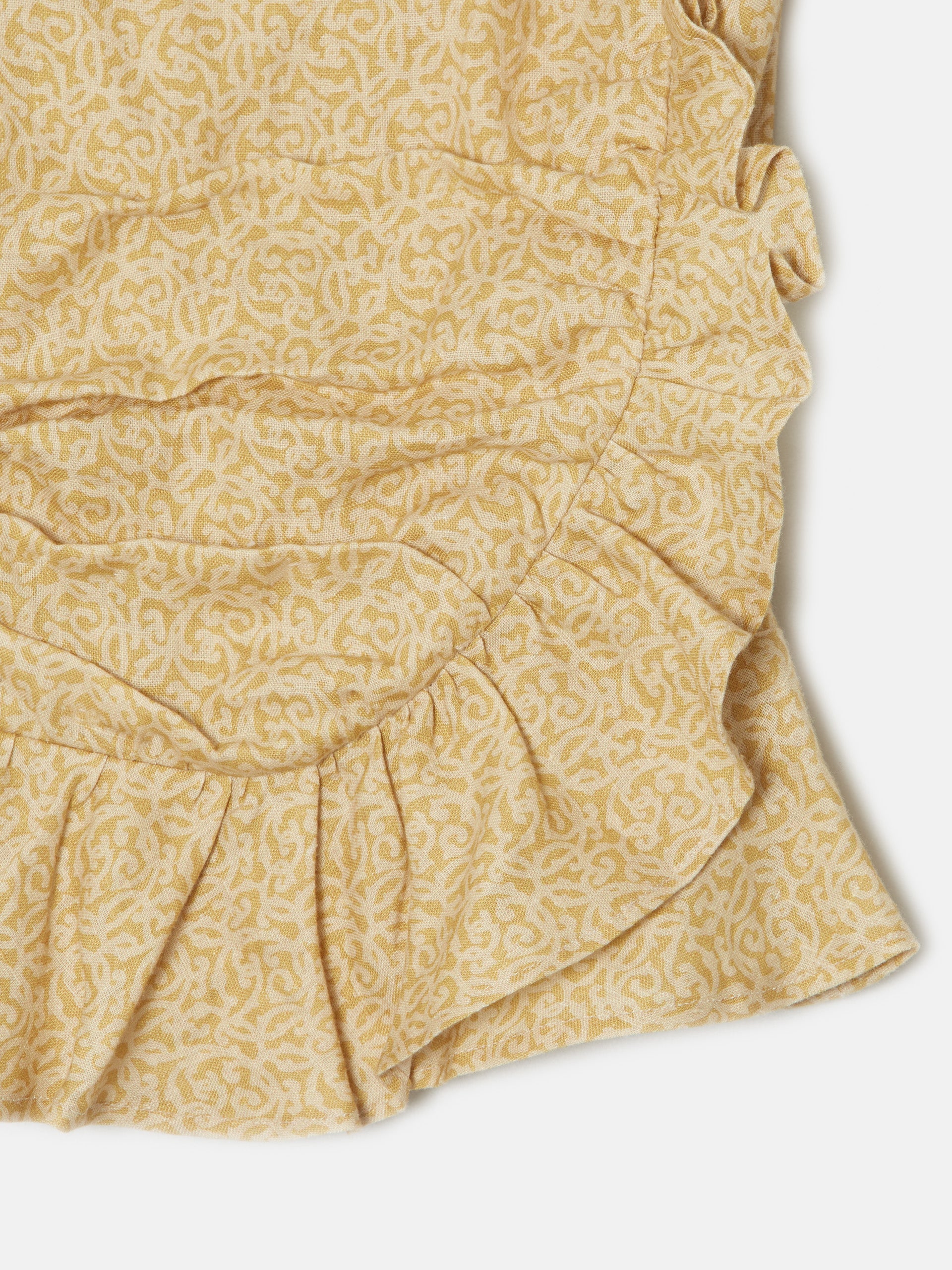 Yellow printed strapless linen top