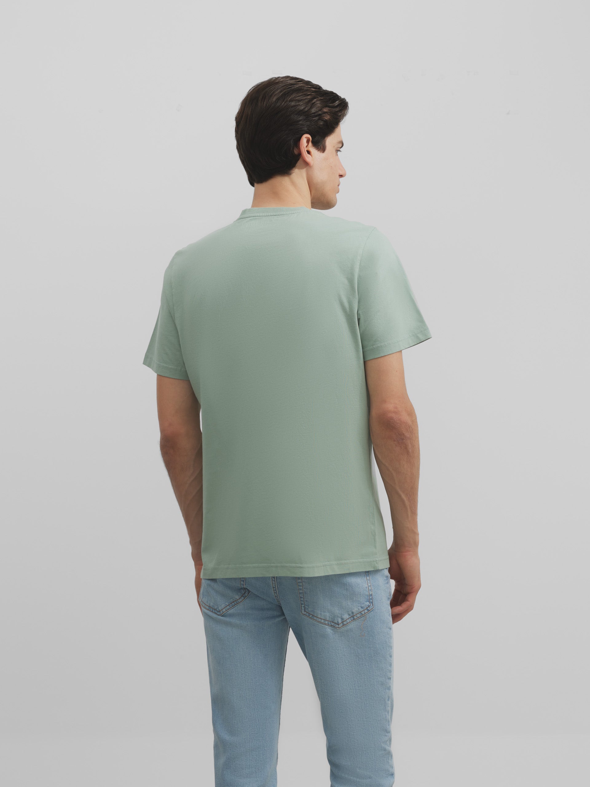 T-shirt vert à poche raquette