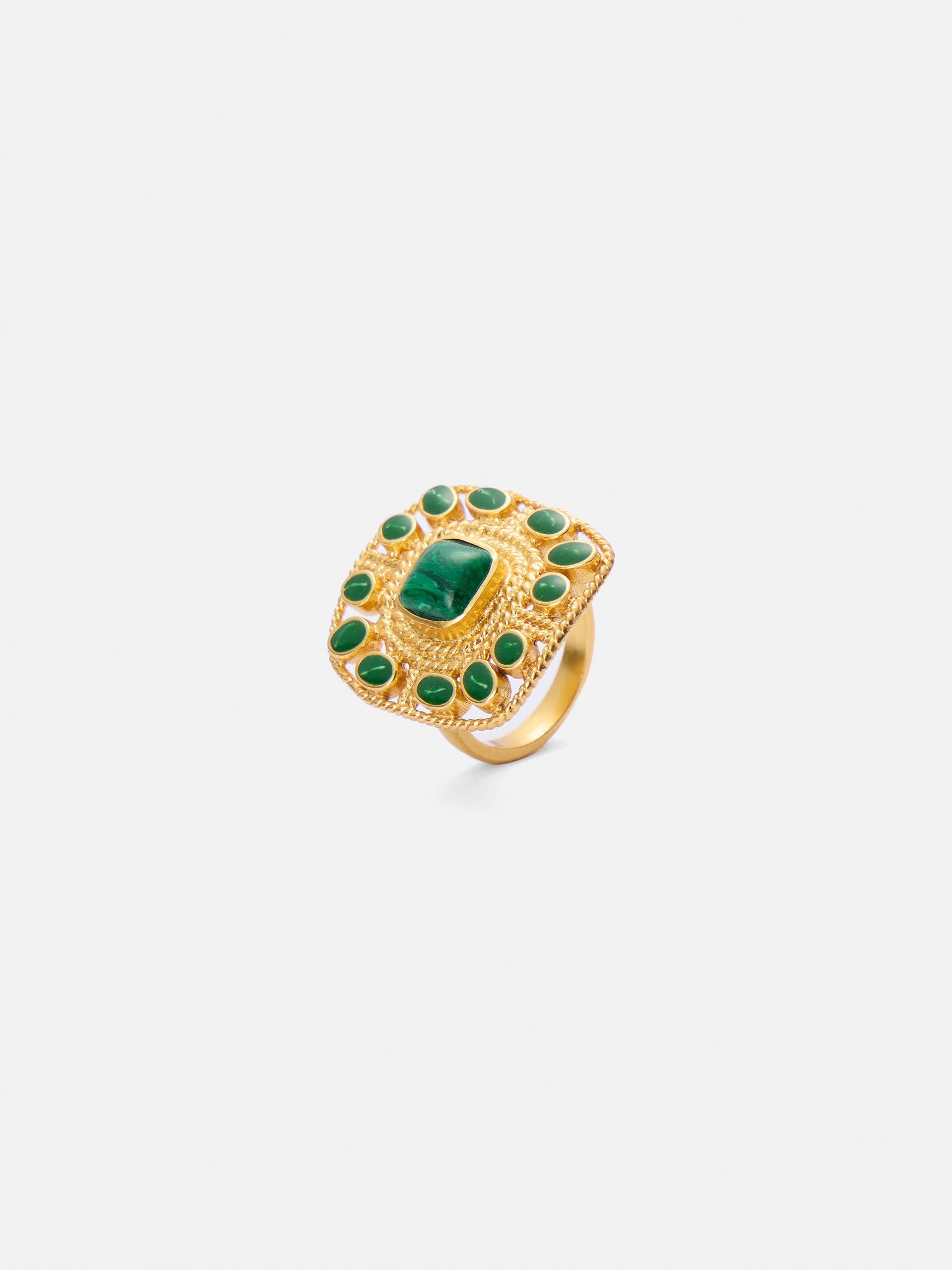 Golden ring with green stones