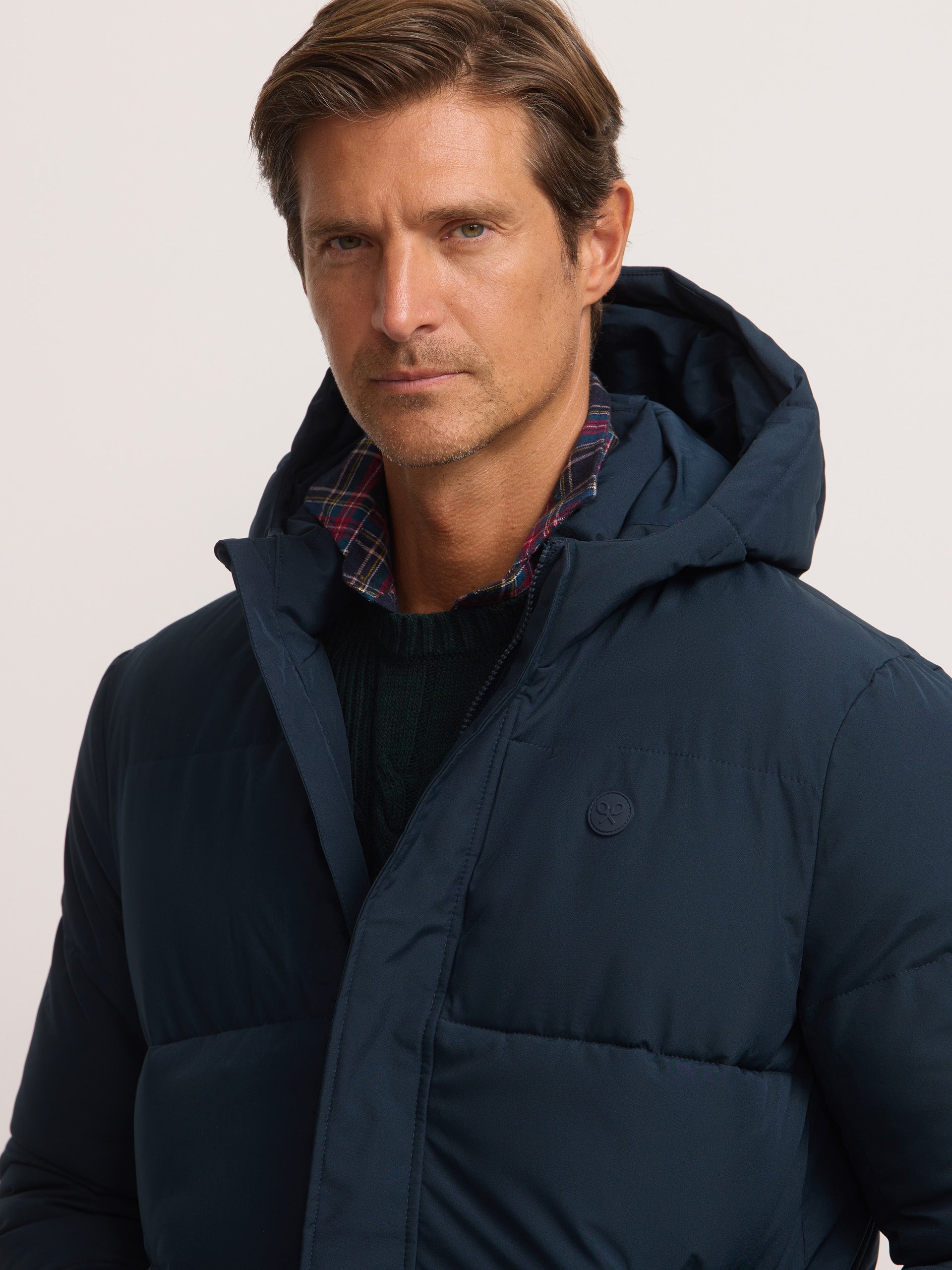 Long padded coat with navy blue hood