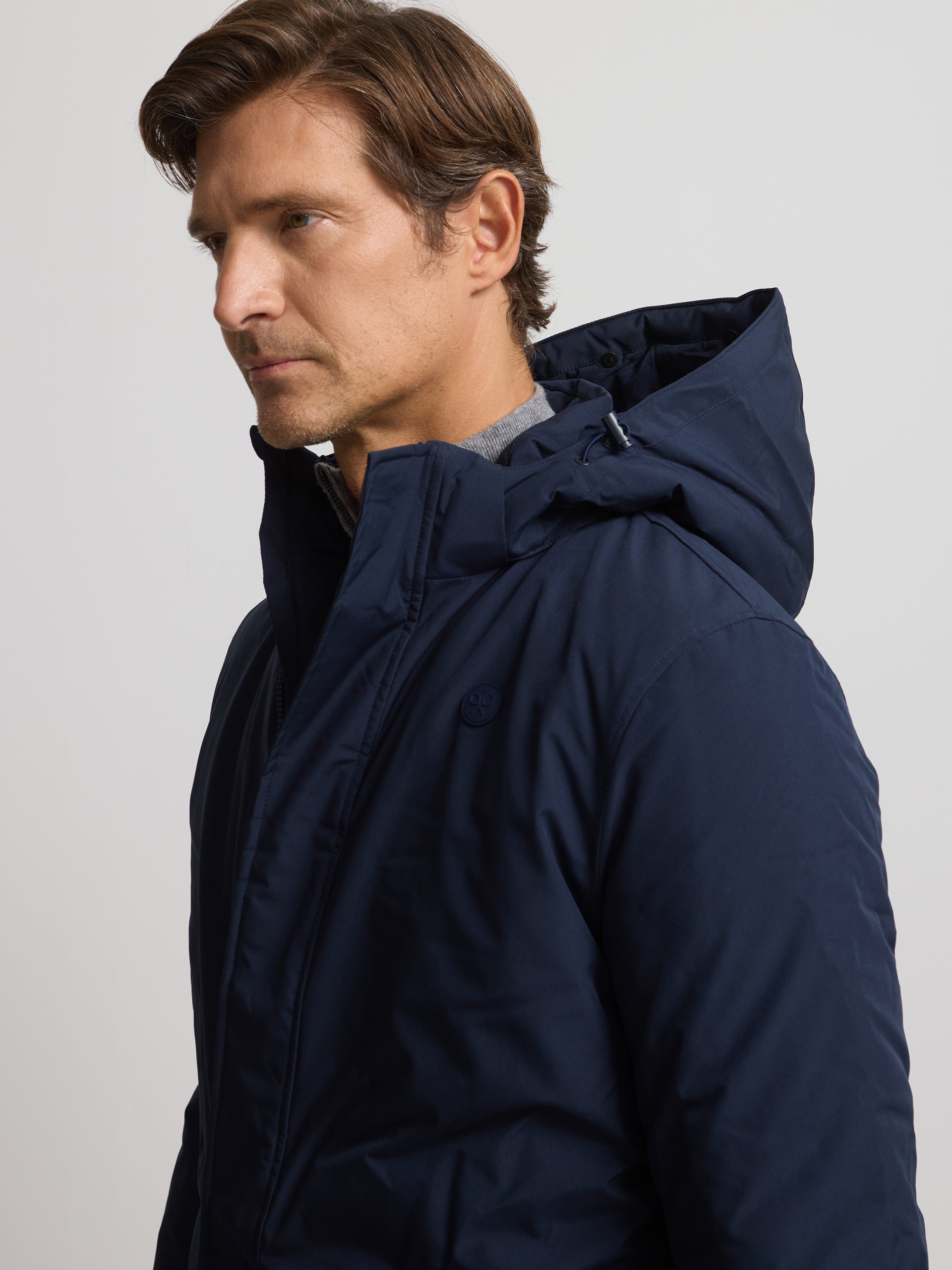 Long technical coat with navy blue hood