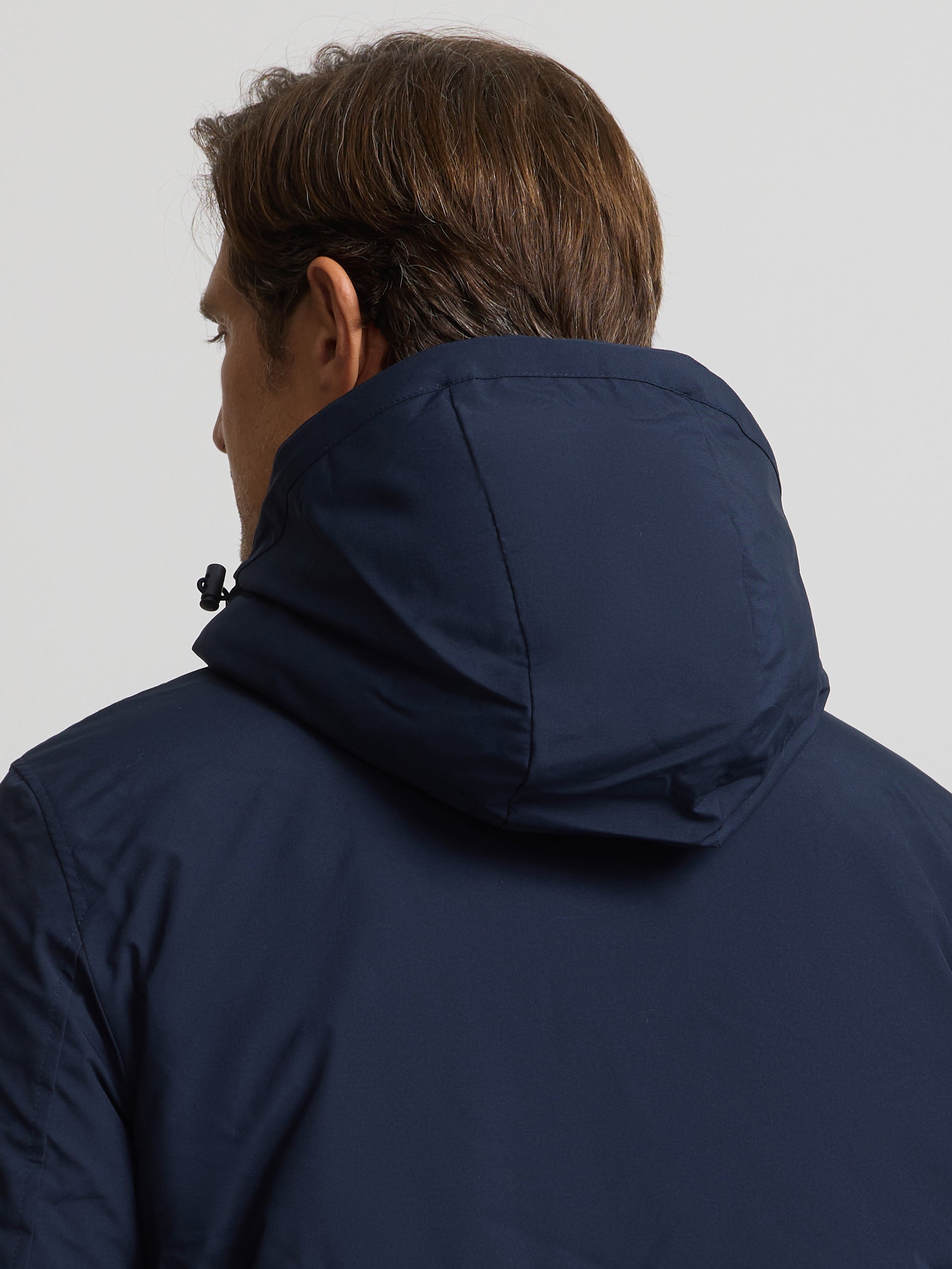 Long technical coat with navy blue hood