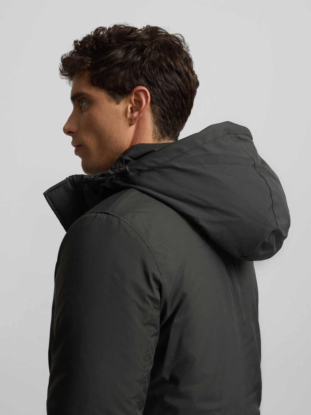 Long technical coat with green hood