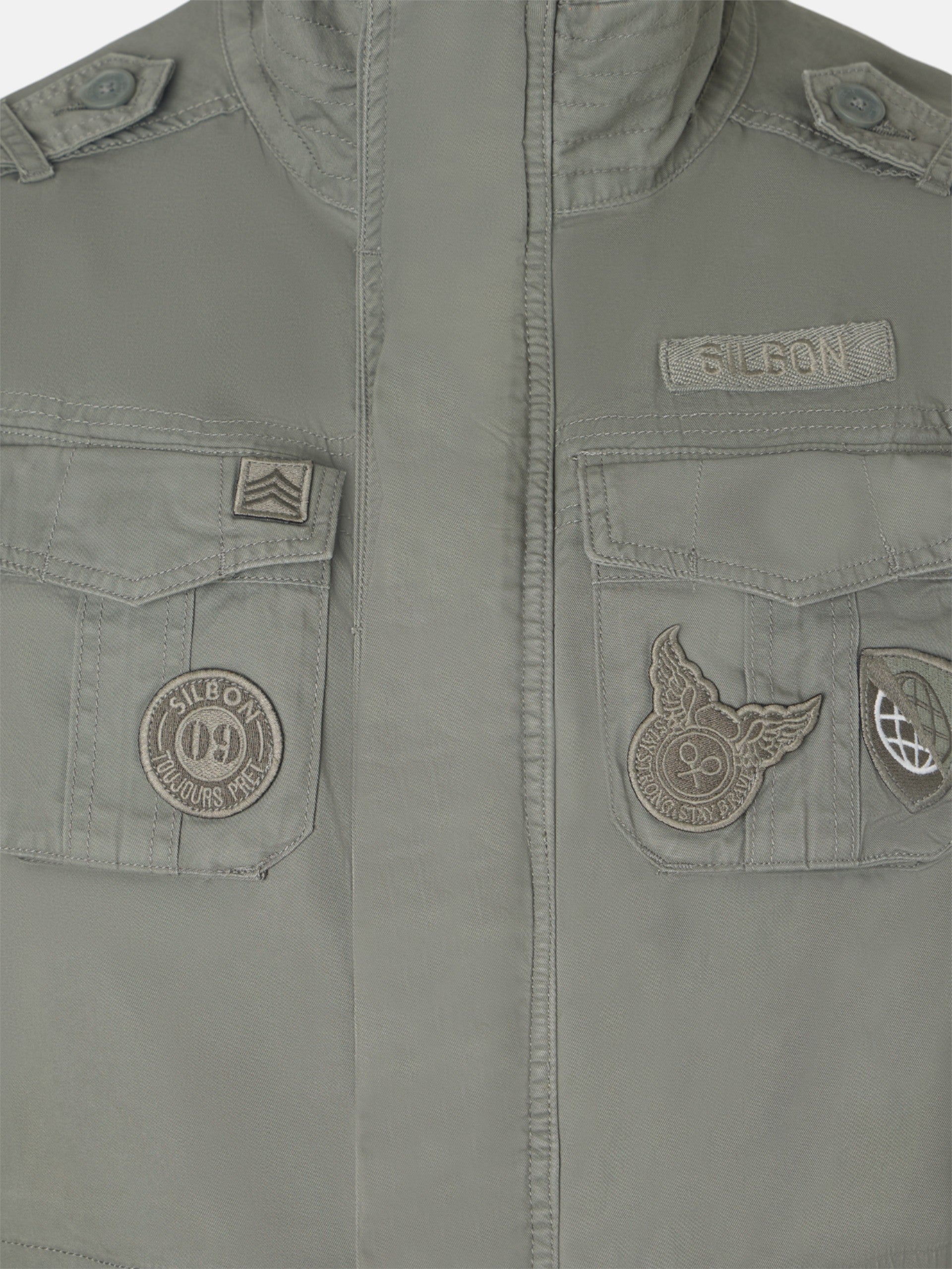 Military jacket with green dye patches