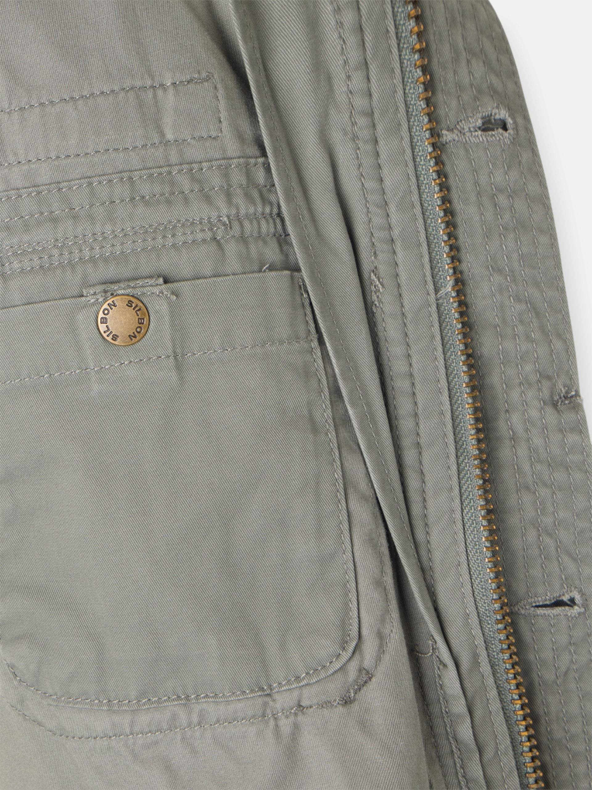 Military jacket with green dye patches