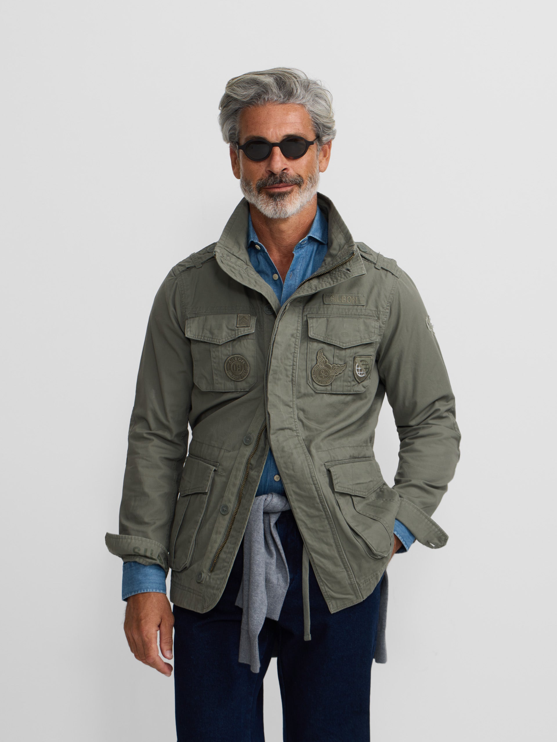 Military jacket with green dye patches