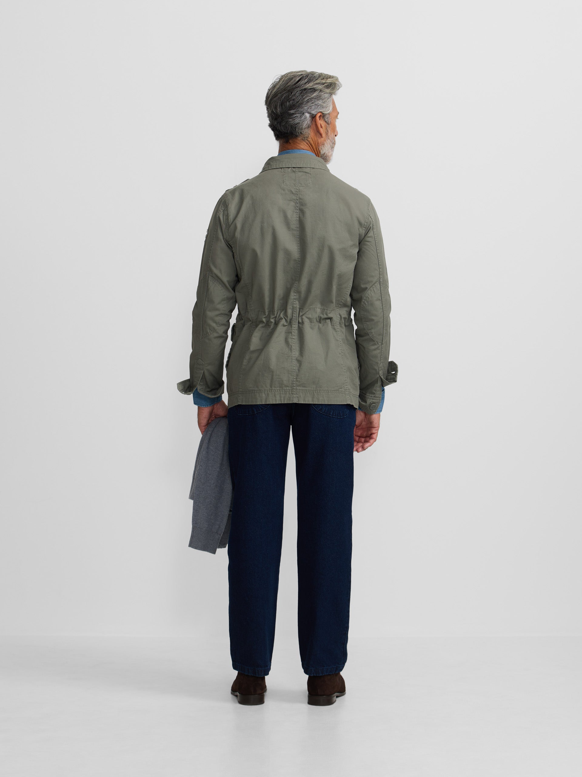 Military jacket with green dye patches