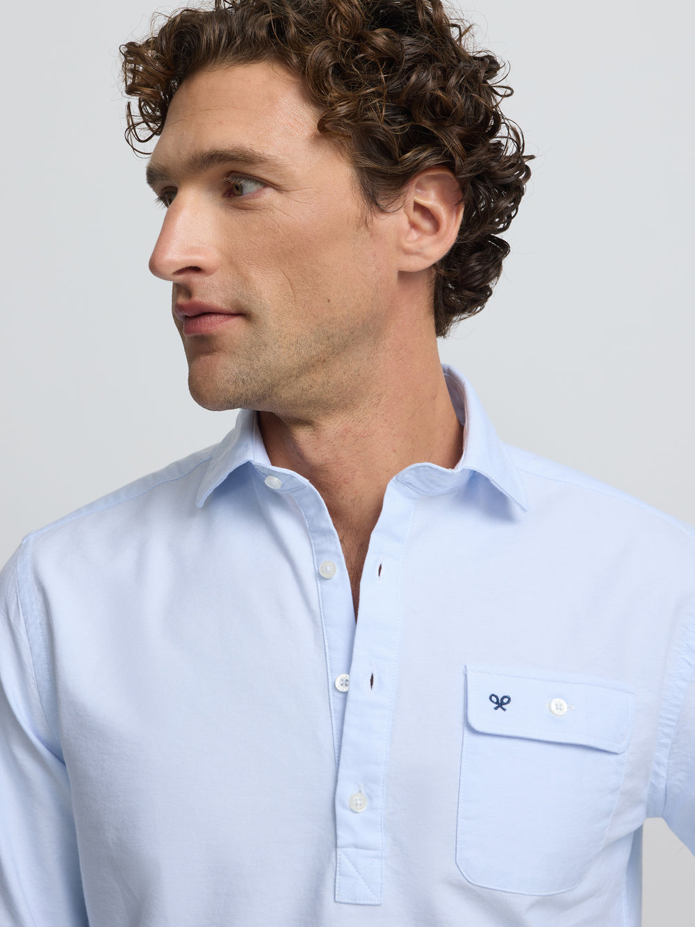 Polo sport Oxford bleu clair avec poche