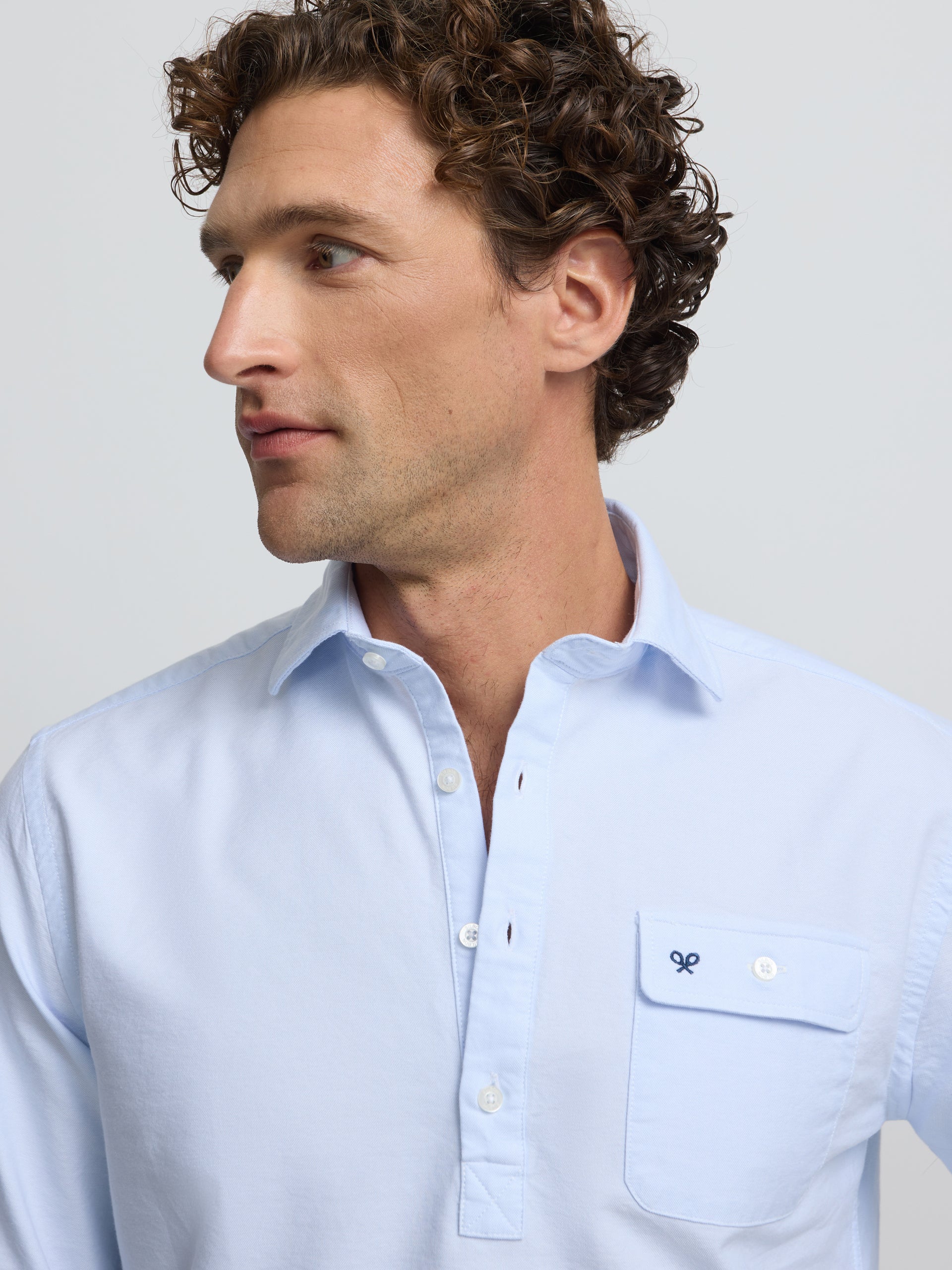Polo sport Oxford bleu clair avec poche