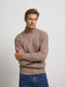 Light brown cable knit turtleneck sweater