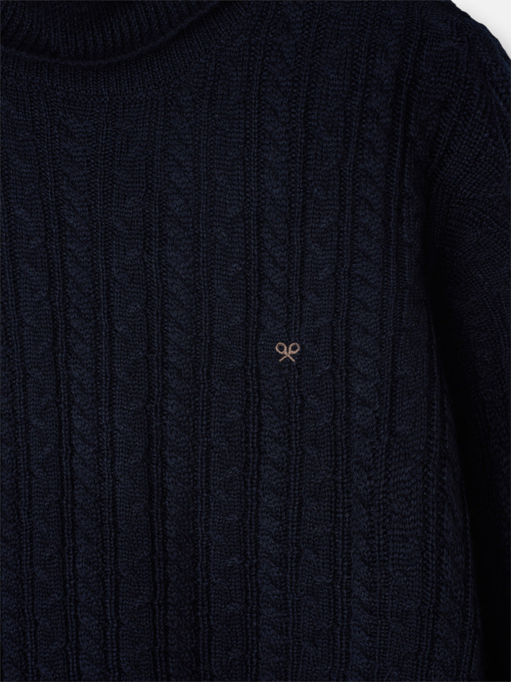 Navy blue cable knit turtleneck sweater