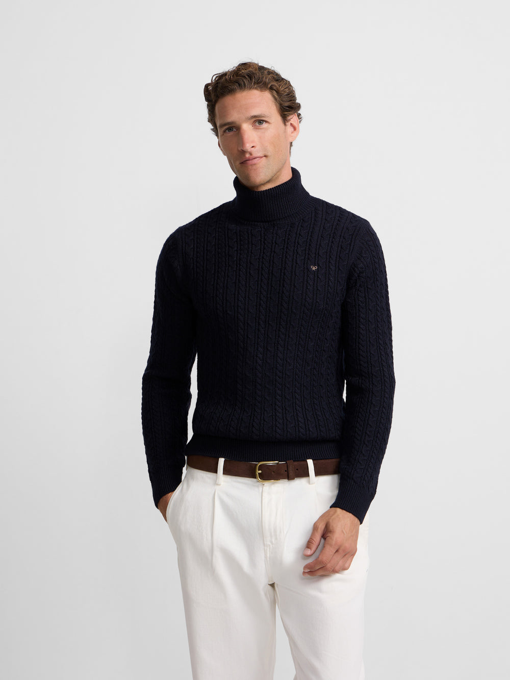 Navy blue cable knit turtleneck sweater