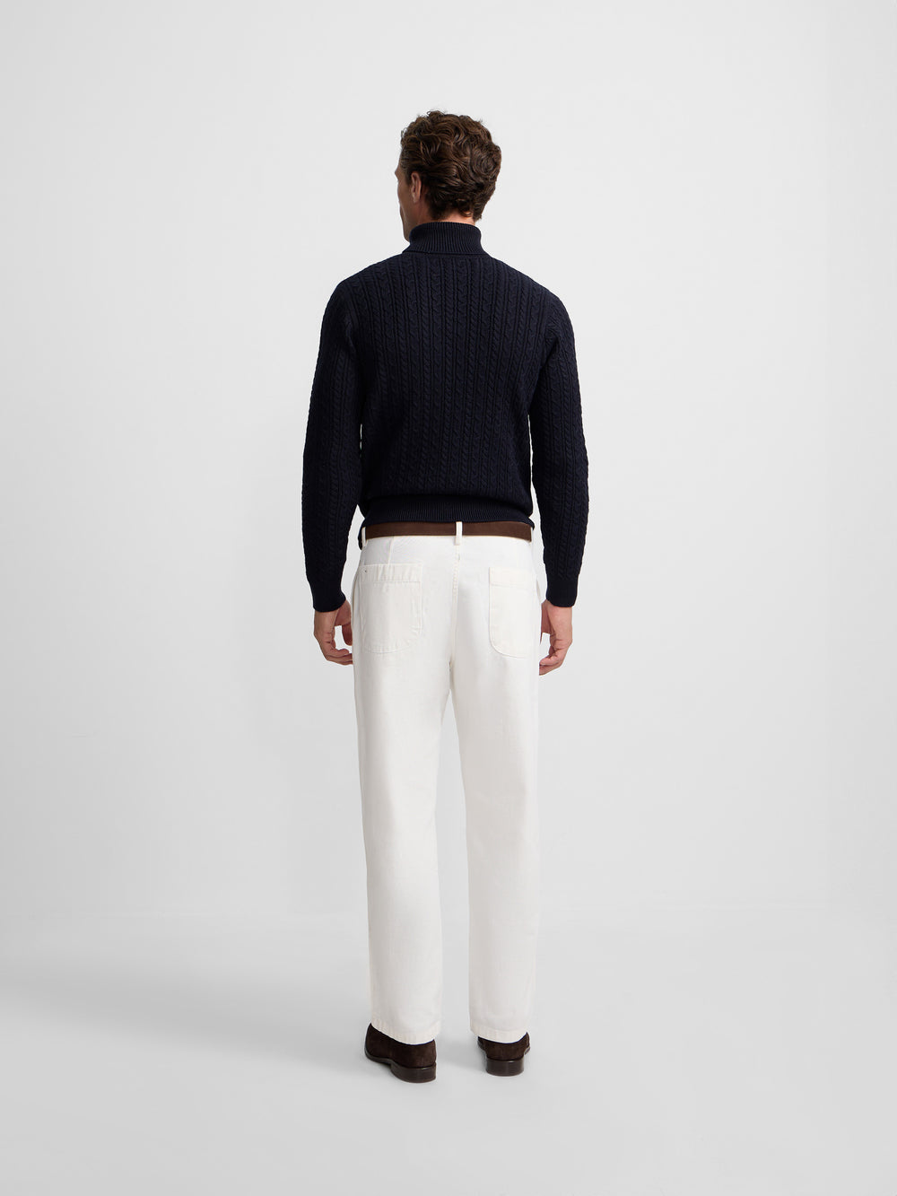 Navy blue cable knit turtleneck sweater