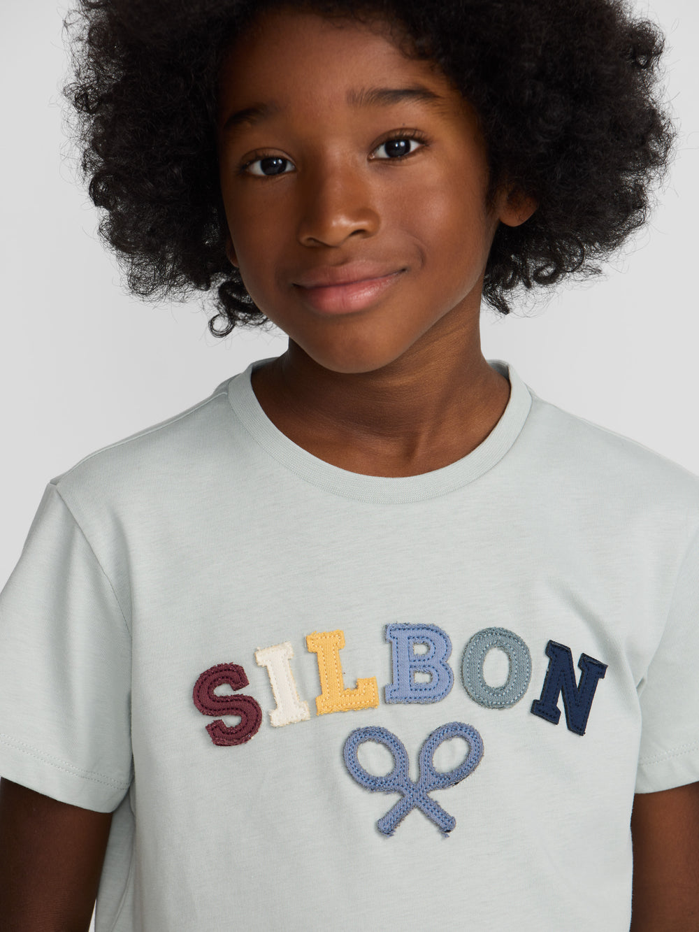 Kids' T-shirt with a multicolored green mid-racket