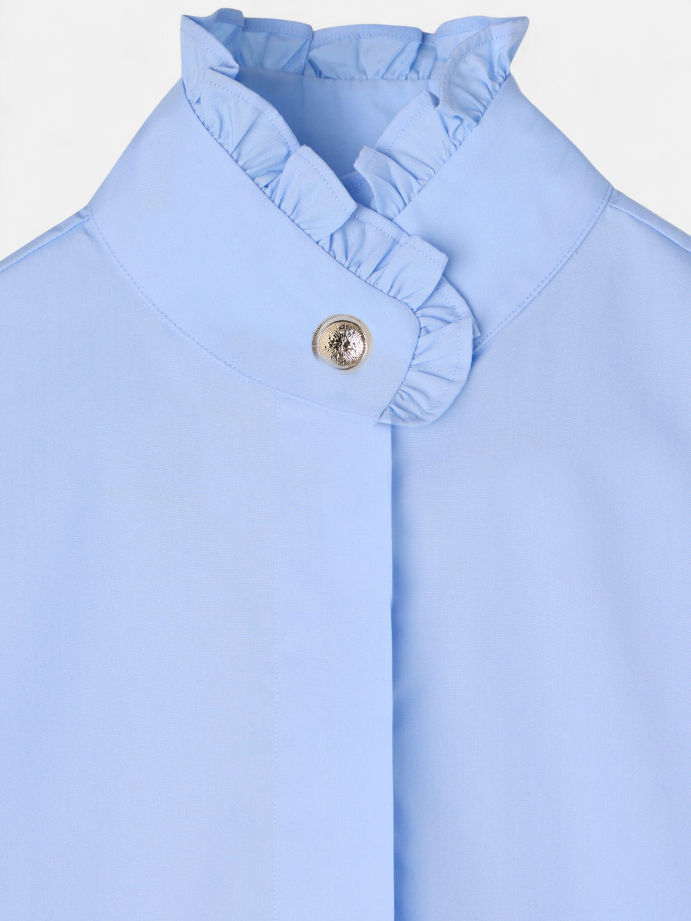 Chemise bleu clair avec détails de poignets