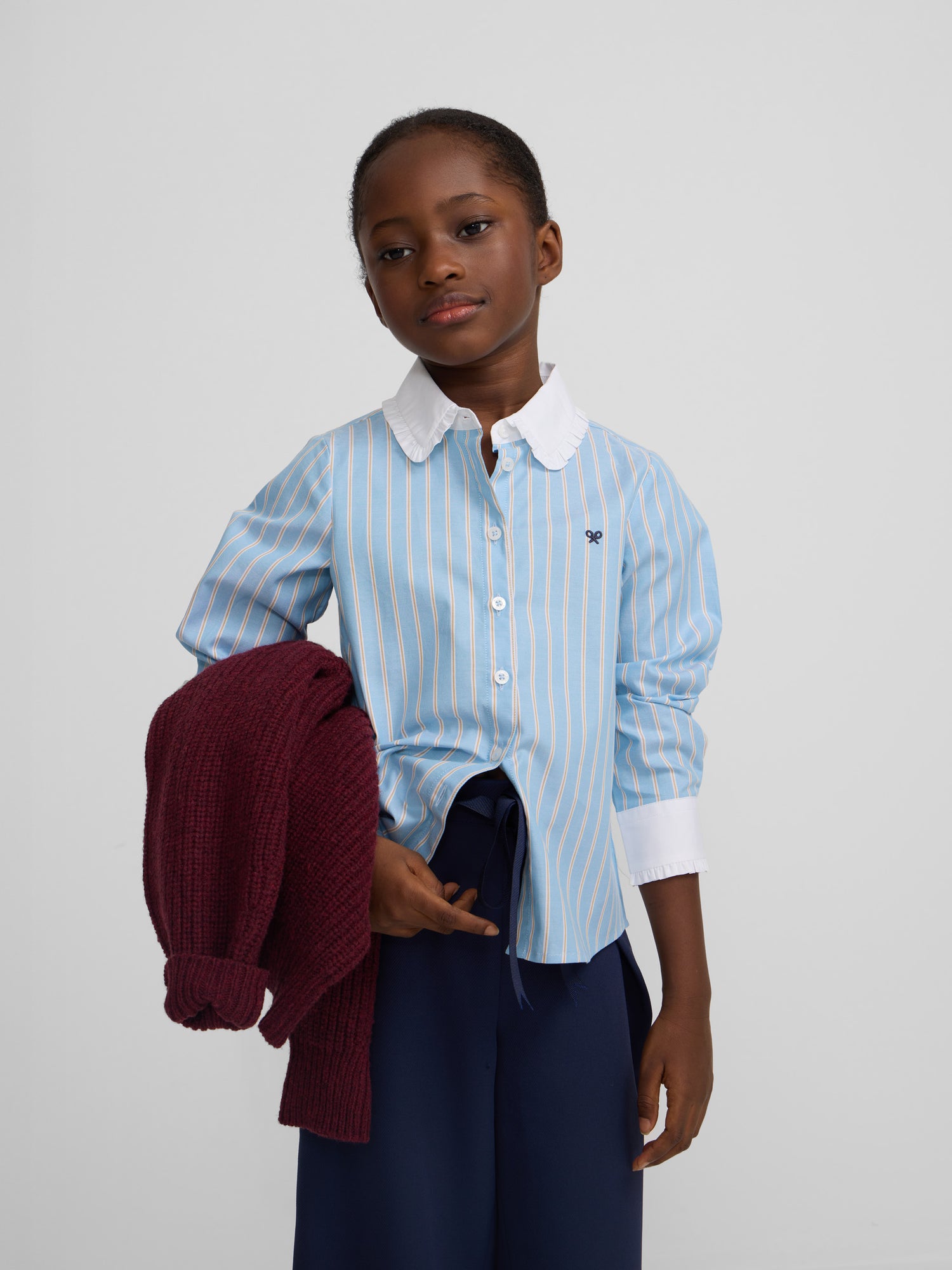 Blue and white striped girl's shirt