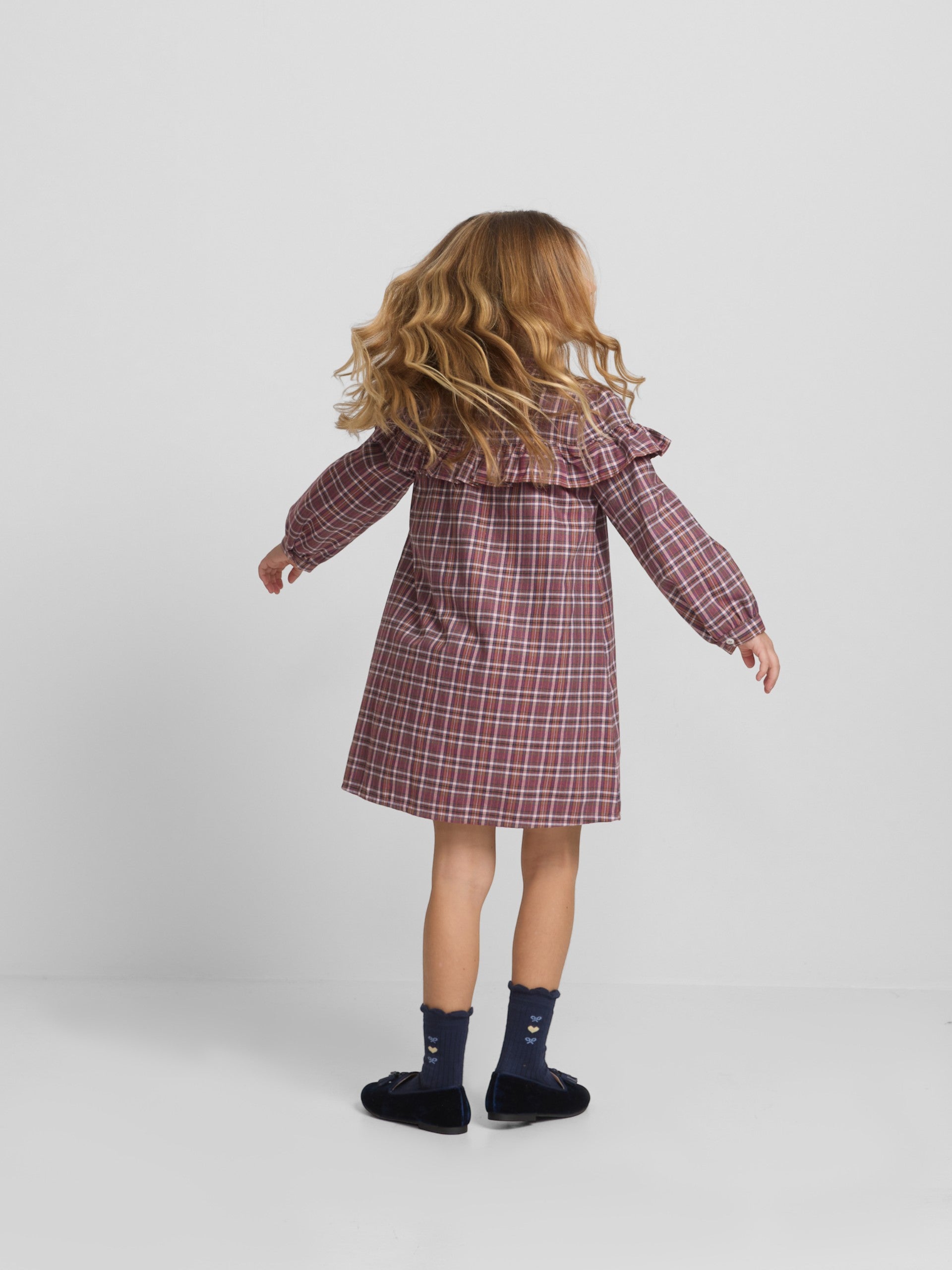 Girl's dress with purple and pink checkered ruffles