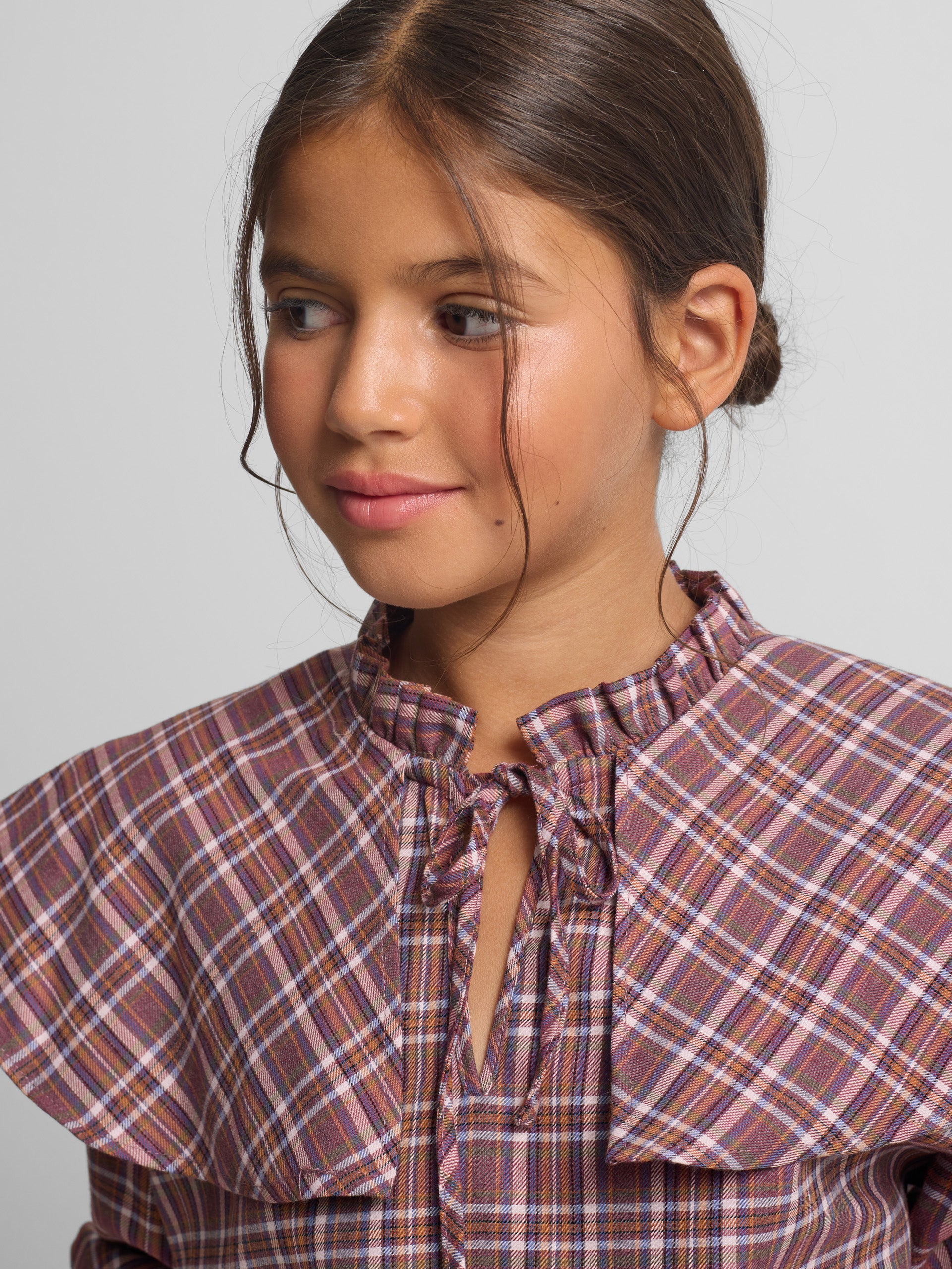 Girl's blouse with purple and pink checkered ruffles