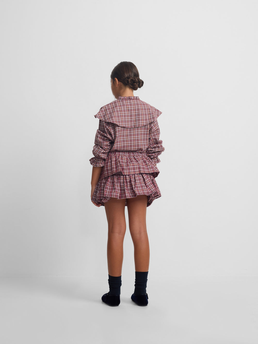 Girl's blouse with purple and pink checkered ruffles