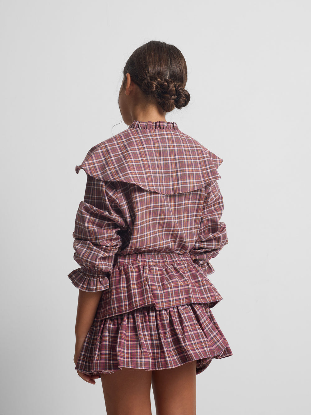 Girl's blouse with purple and pink checkered ruffles