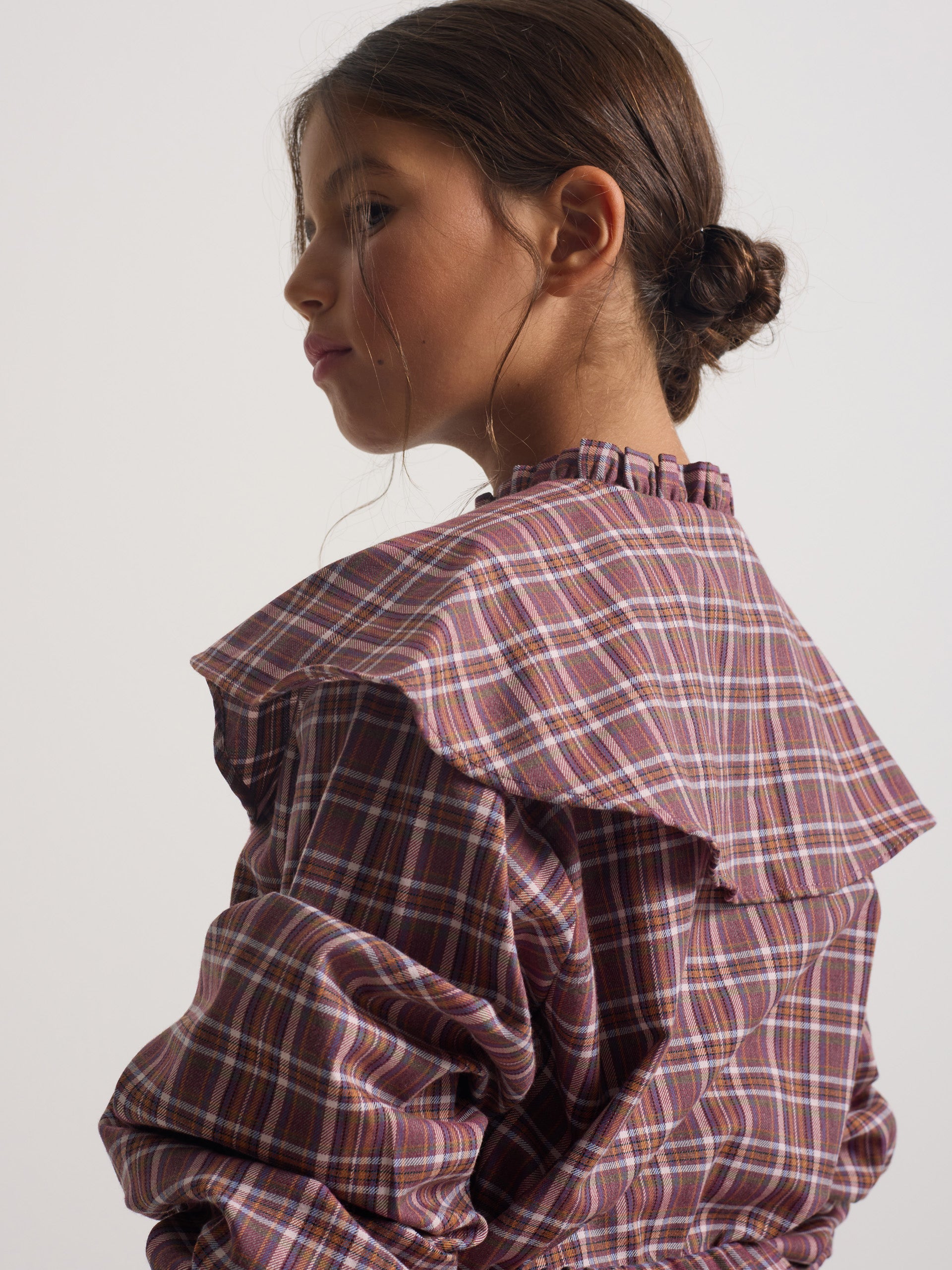 Girl's blouse with purple and pink checkered ruffles