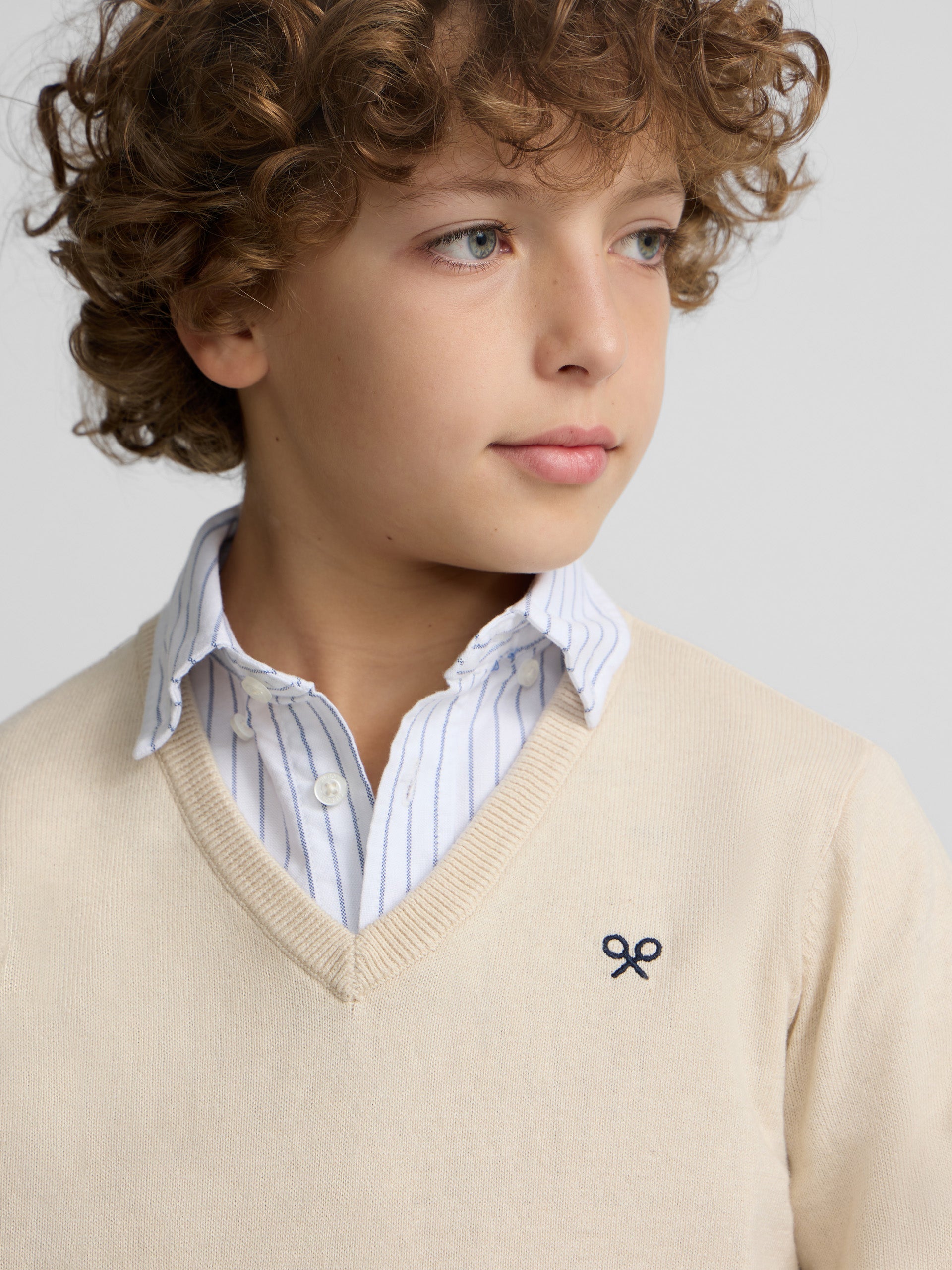 Camisola de criança bege com decote em V