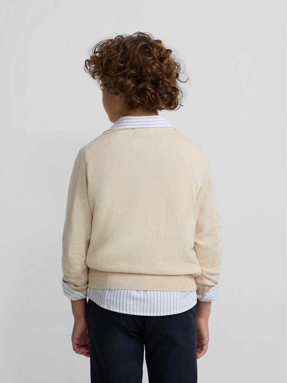 Camisola de criança bege com decote em V