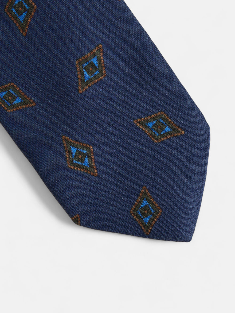 Gravata com padrão de losangos azul-marinho