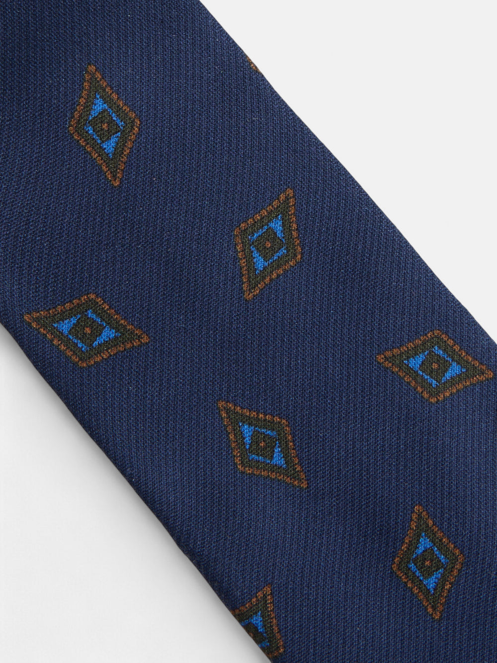 Gravata com padrão de losangos azul-marinho