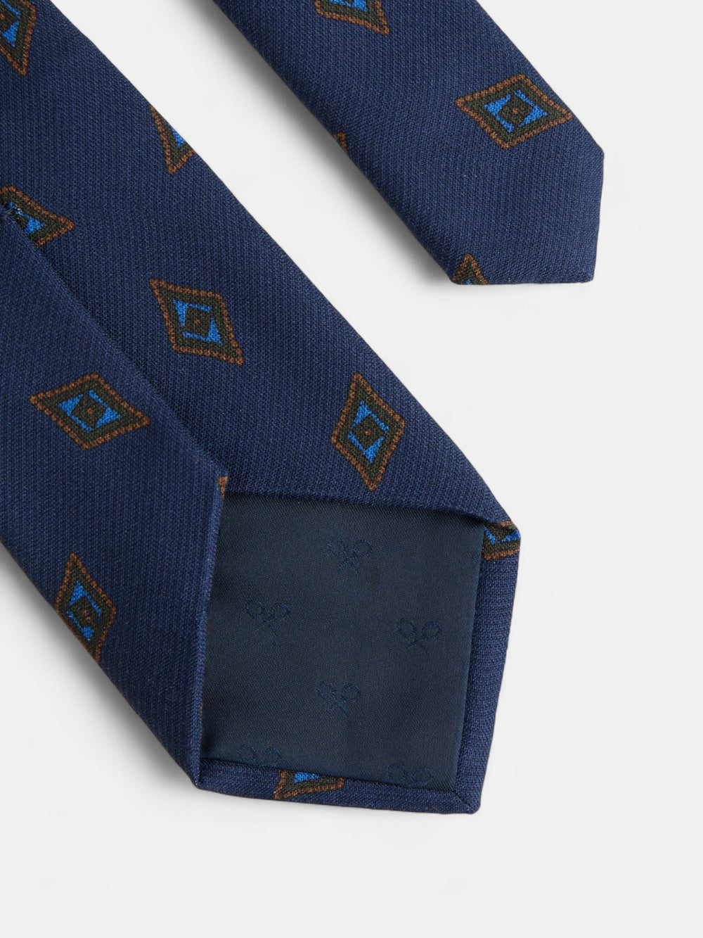Gravata com padrão de losangos azul-marinho