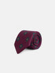Corbata seda motivo geometrico burdeos
