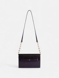 Bolsa de pele roxa com aba
