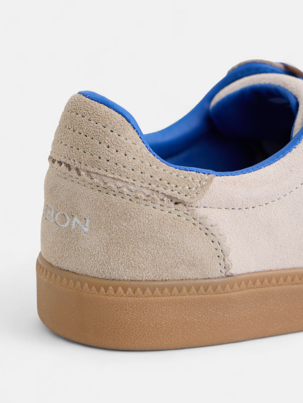 Beige and blue racket shoe