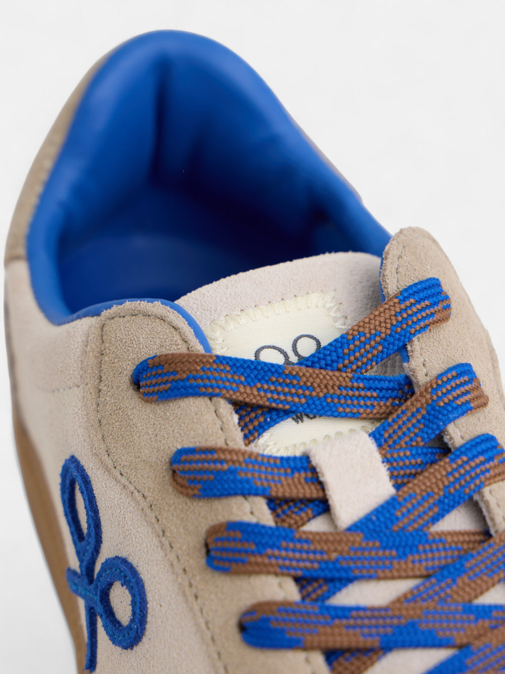 Beige and blue racket shoe