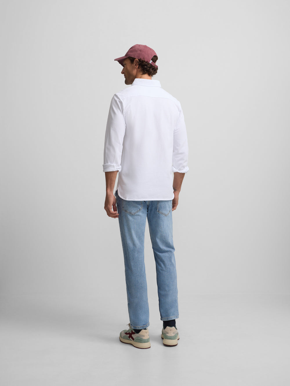 Plain white long-sleeved polo shirt