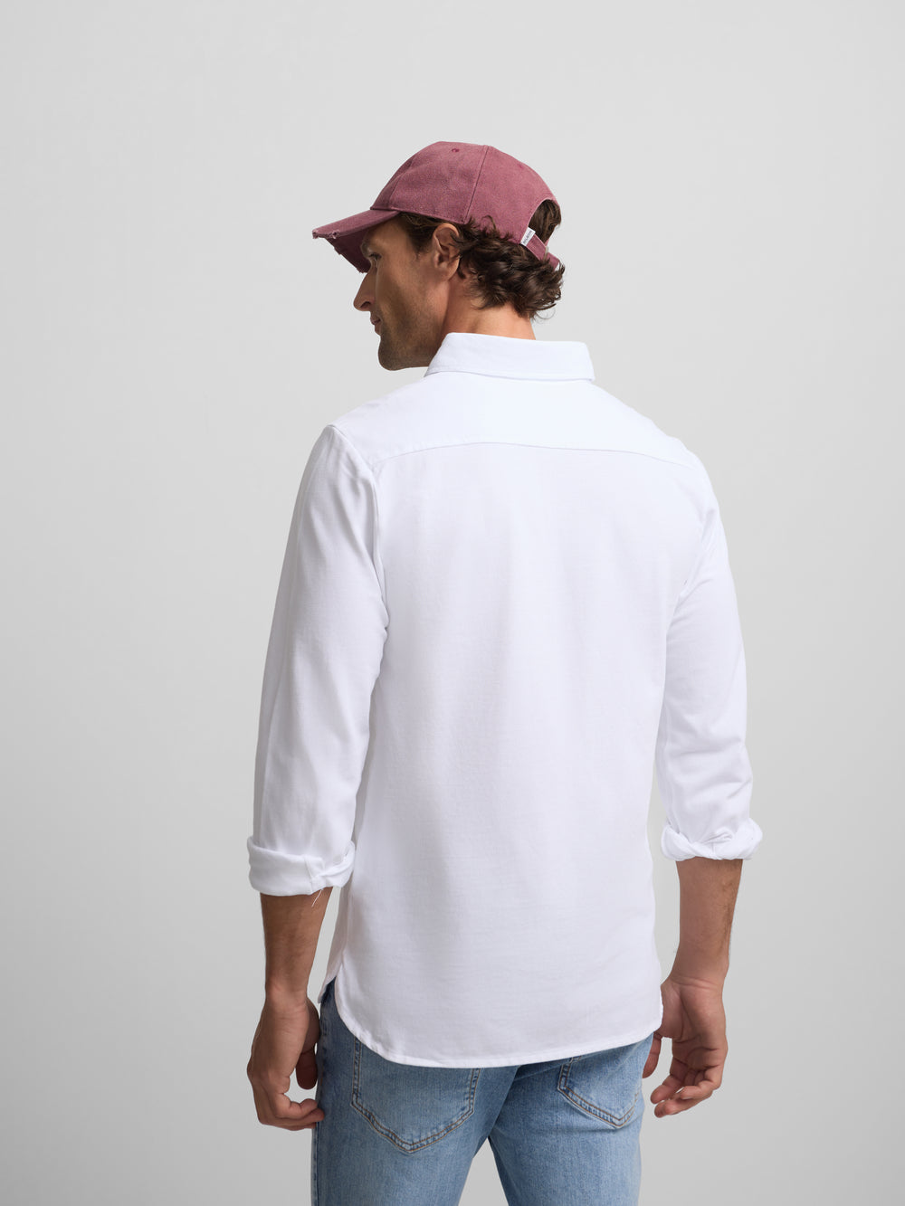 Plain white long-sleeved polo shirt