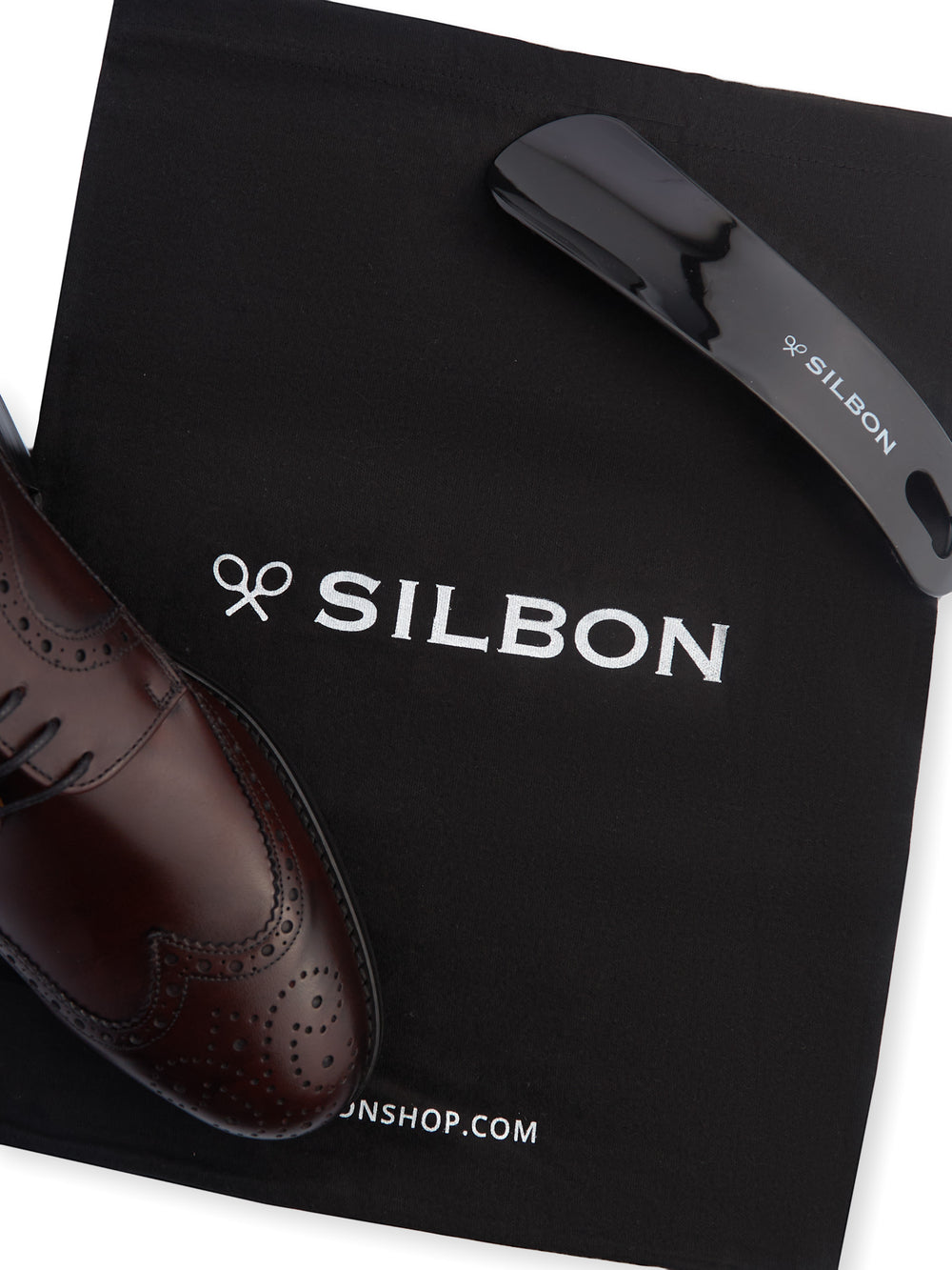 Zapato clasico piel perforado burdeos