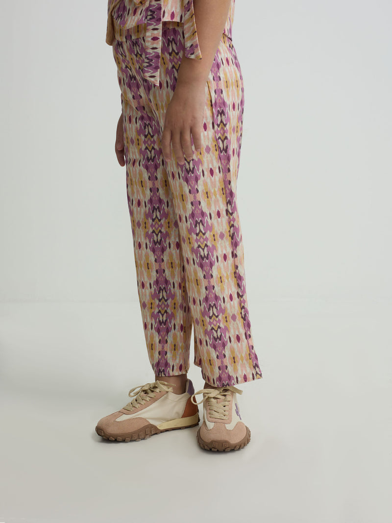 Calças de menina em linho estampado ikat rosas