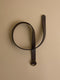 Dark brown leather belt with round buckle