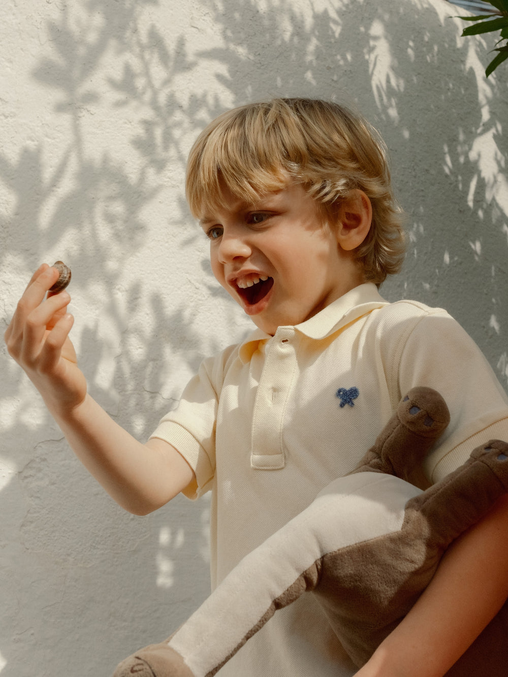 Polo enfant uni logo bouclé jaune