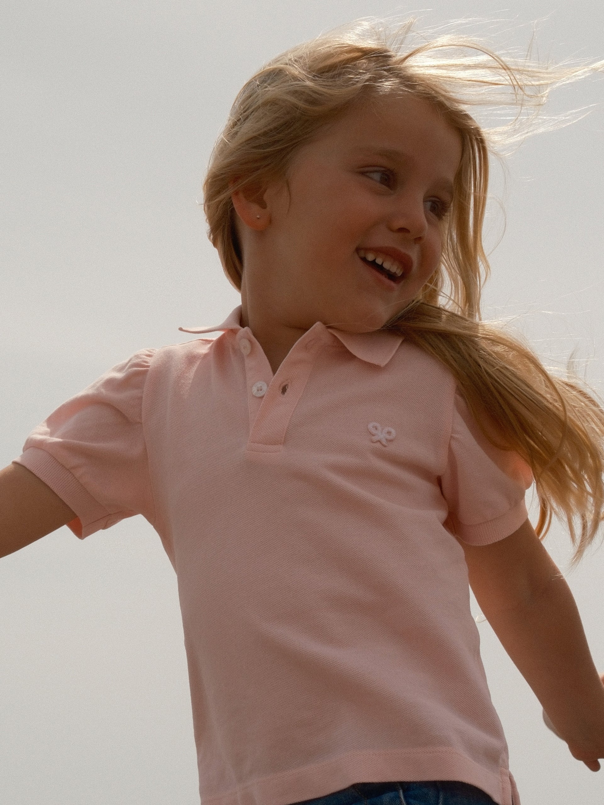Polo fille à manches bouffantes rose clair