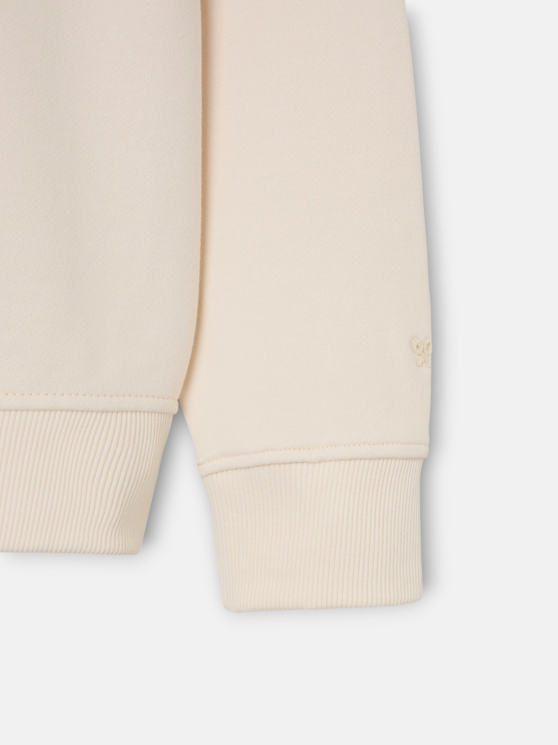 Sudadera bolsillo etiqueta crema