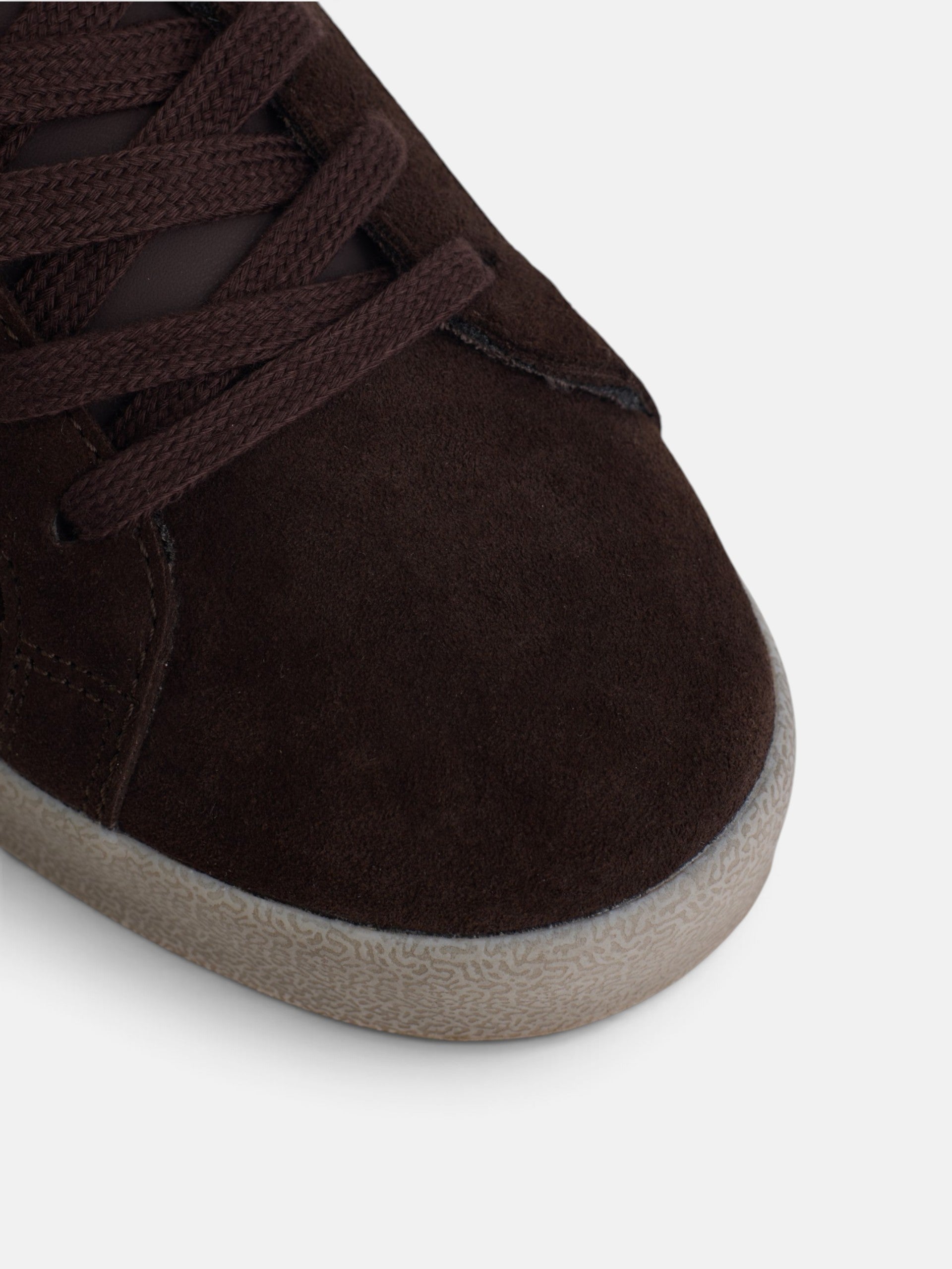 Worn brown suede sneaker