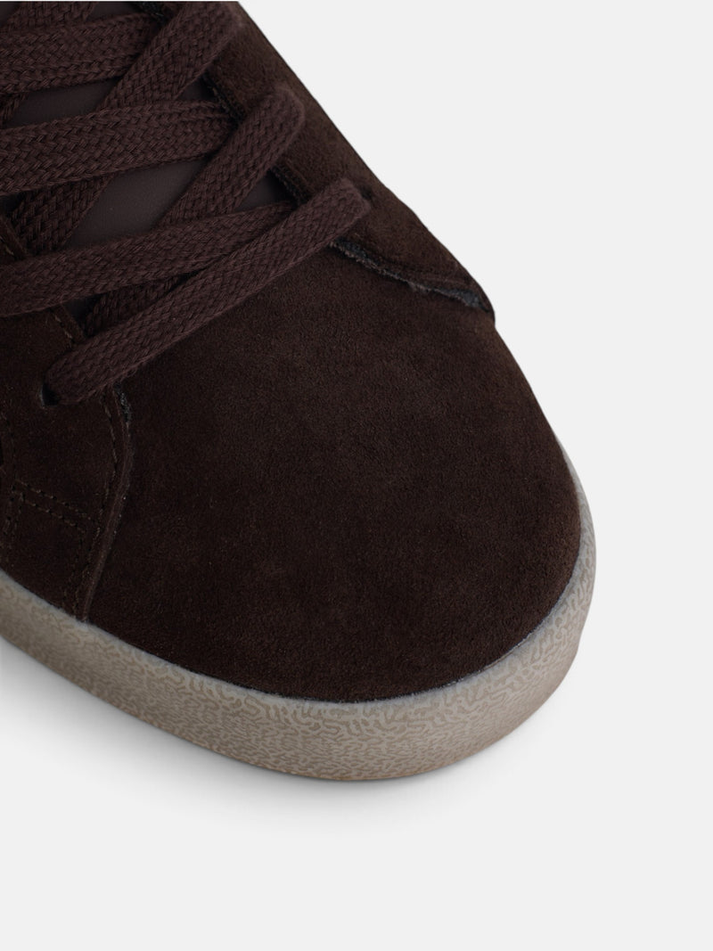 Worn brown suede sneaker